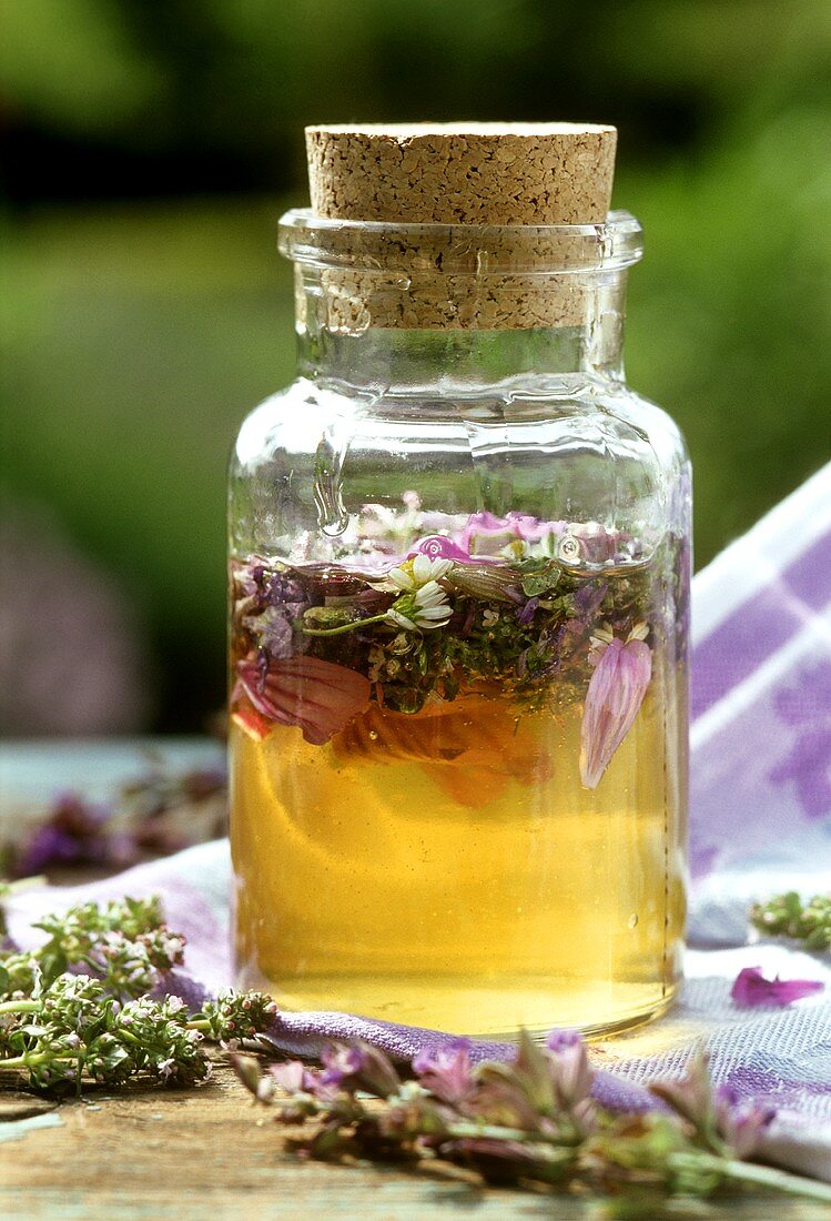 Jar of acacia honey, flavoured with edible flowers