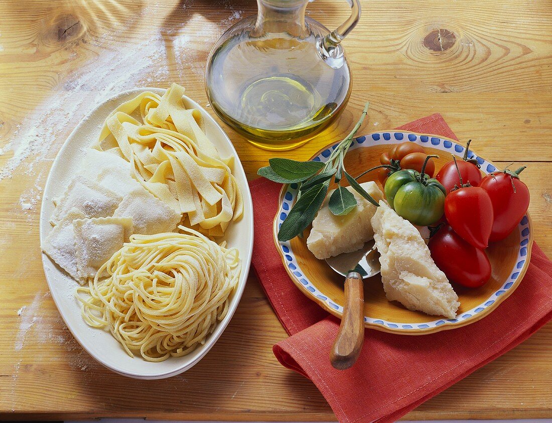 Various types of pasta, olive oil, sage, Parmesan & tomatoes