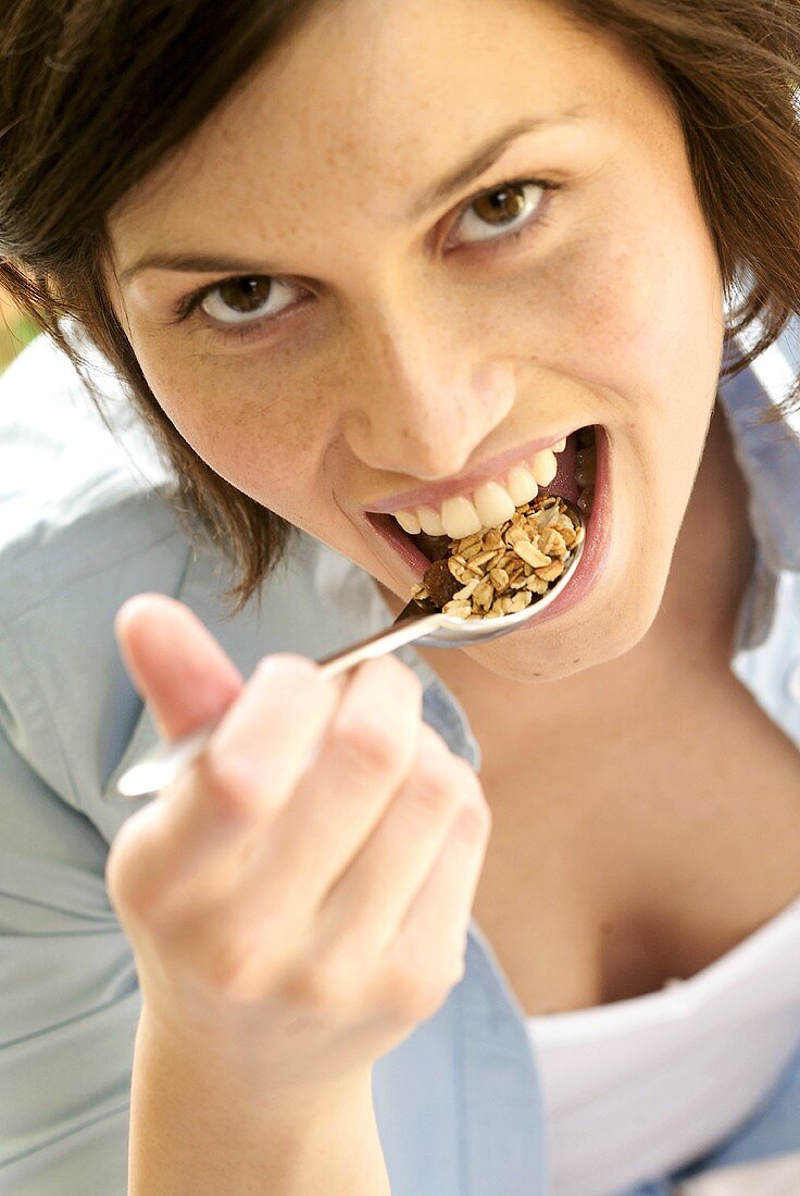 Woman eating oat muesli