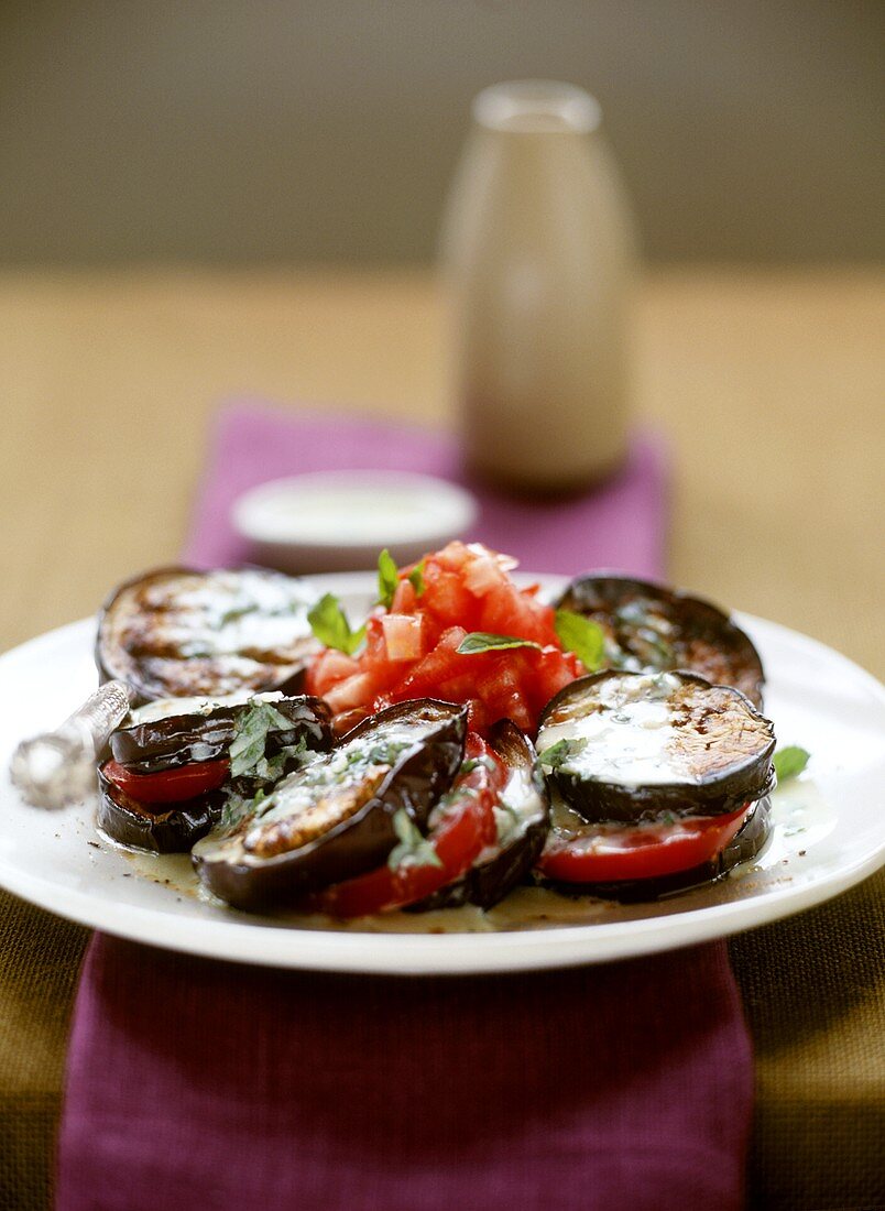 Aubergine and tomato salad with minted yoghurt dressing