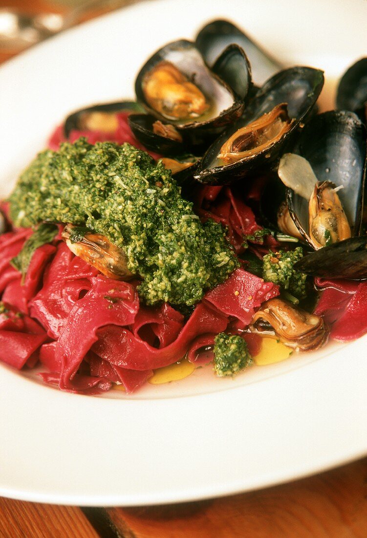 Beetroot tagliatelle with pesto and mussels