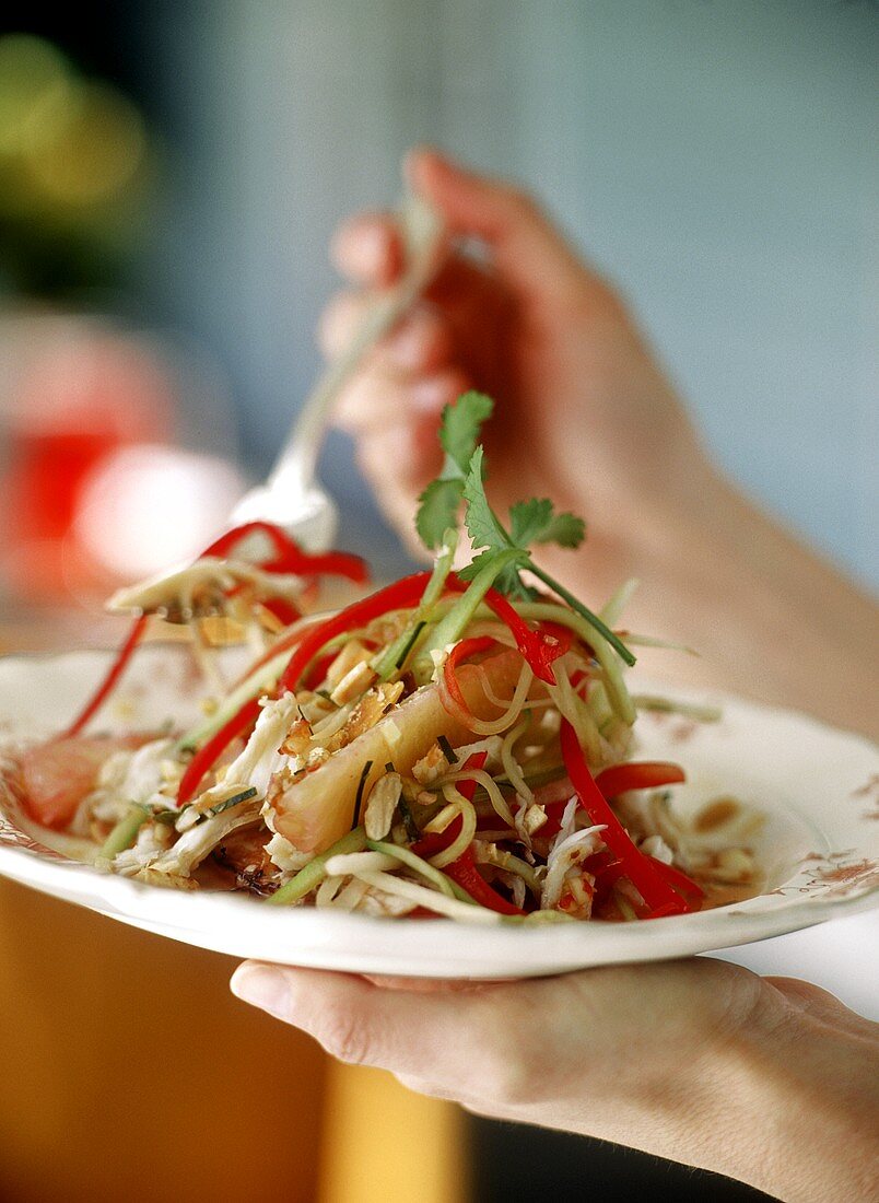 Crabmeat and vegetable salad with pieces of grapefruit