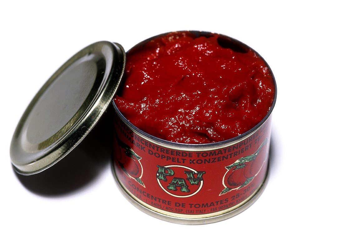 Opened tin of concentrated tomato puree