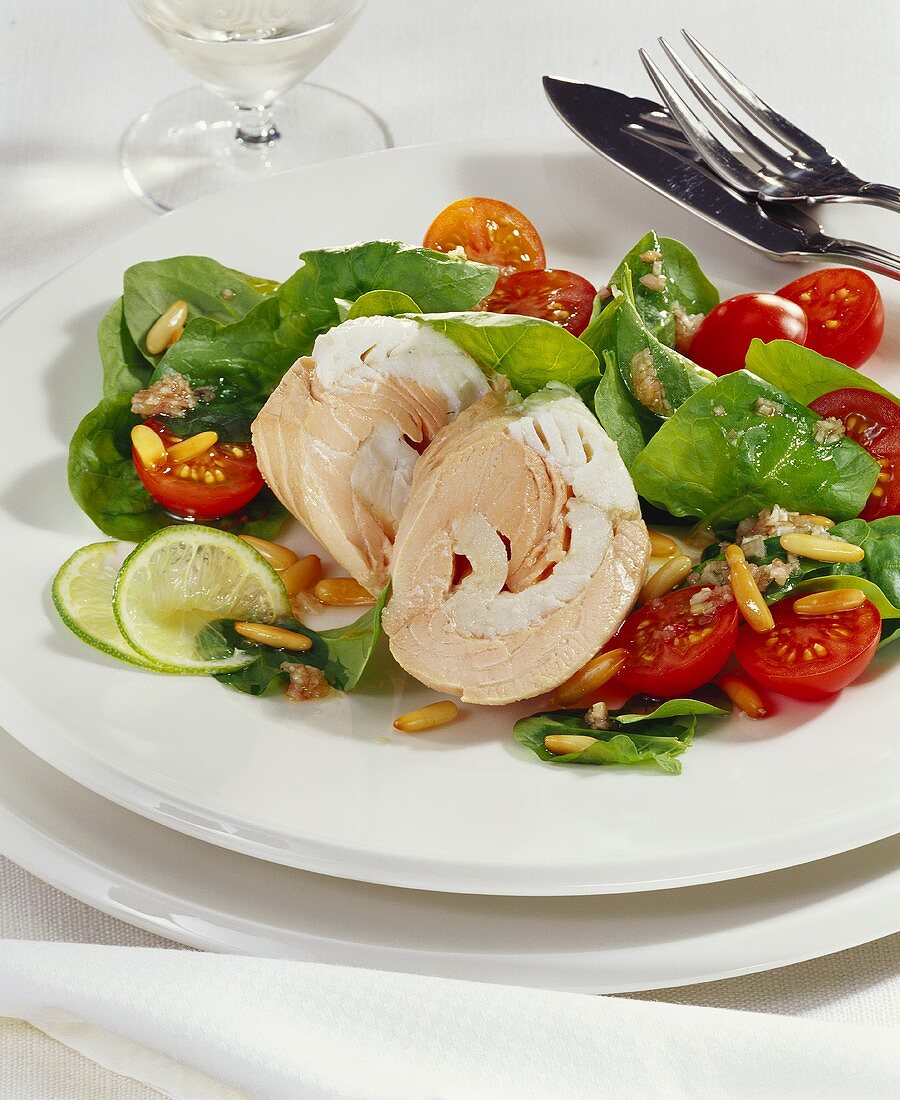Salmon & pike-perch roll on spinach salad with cherry tomatoes