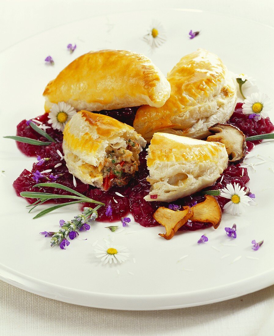 Mushroom pirogi on onions in red wine with lavender flowers