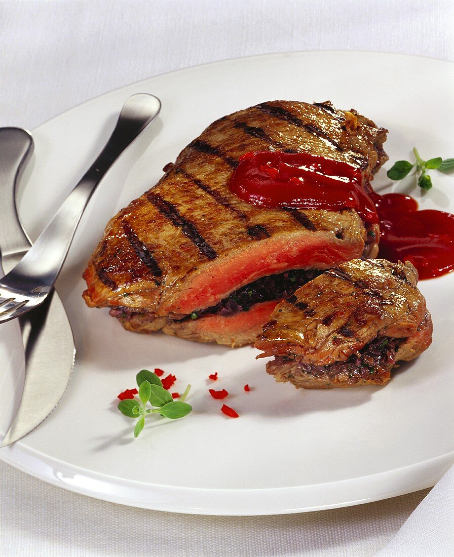 Stuffed, grilled steak with fiery ketchup