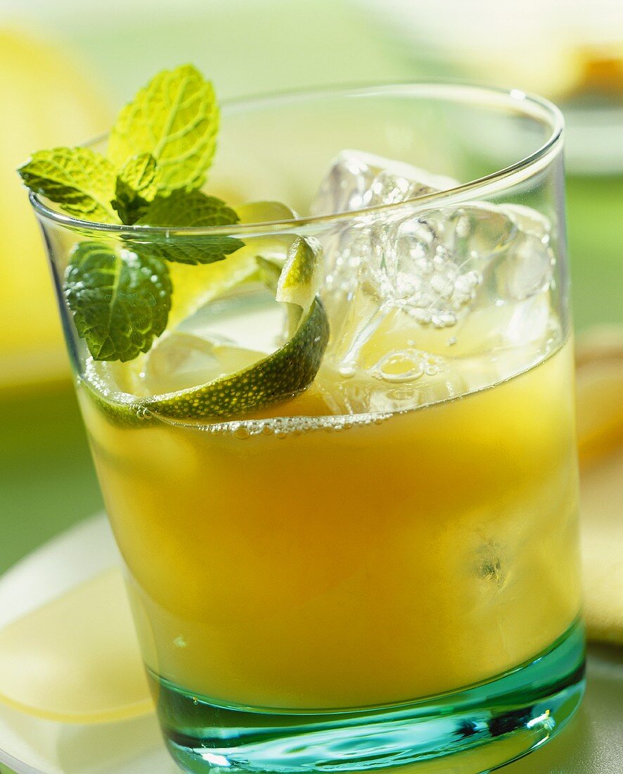 Mai Tai in glass, garnished with lime peel and mint