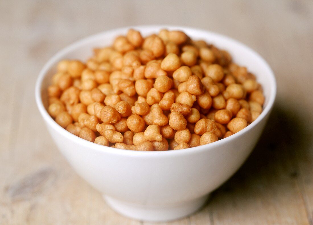 Backerbsen (soup garnish) in a white bowl