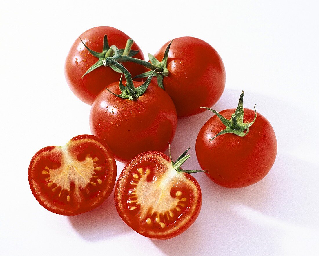 Vine tomatoes, one halved
