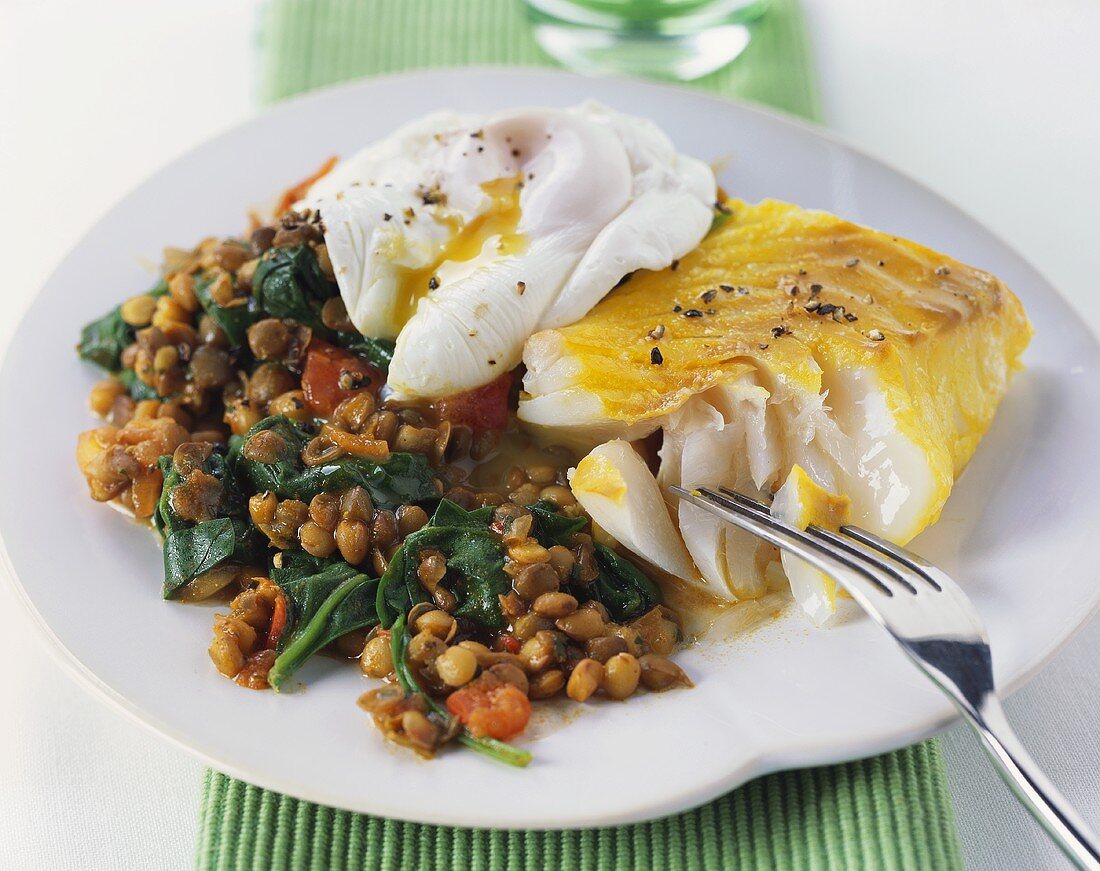 Haddock fillet with poached egg and lentils & spinach