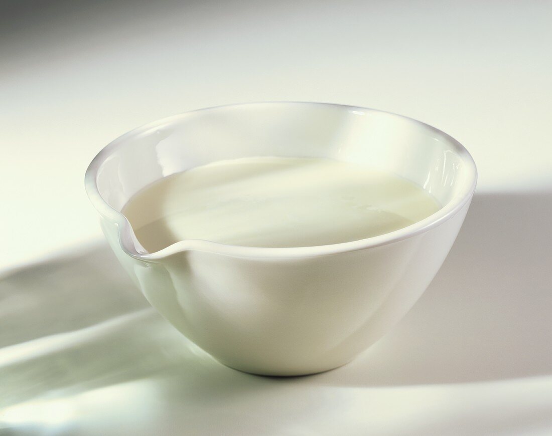 Cream in a white china bowl