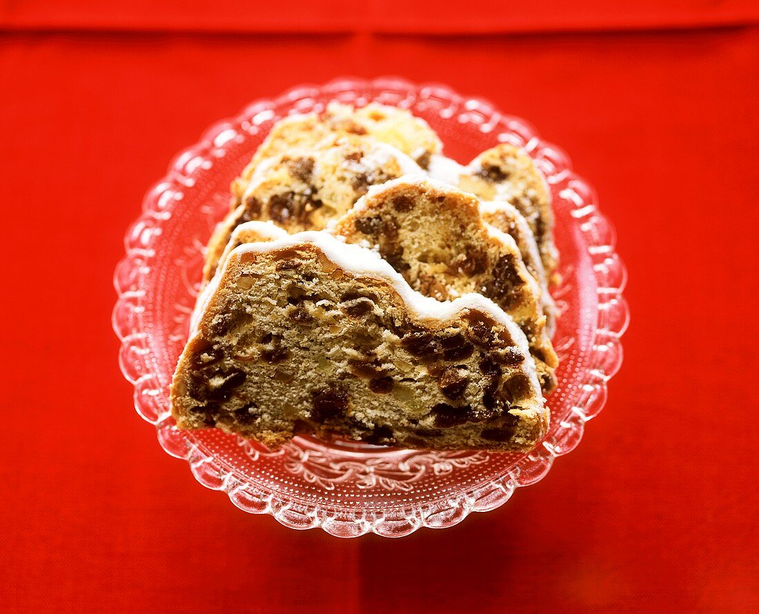 A few slices of raisin stollen on glass plate