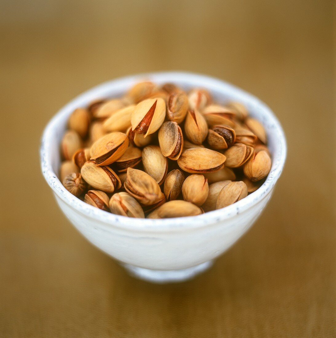 Roasted, salted pistachios in a bowl