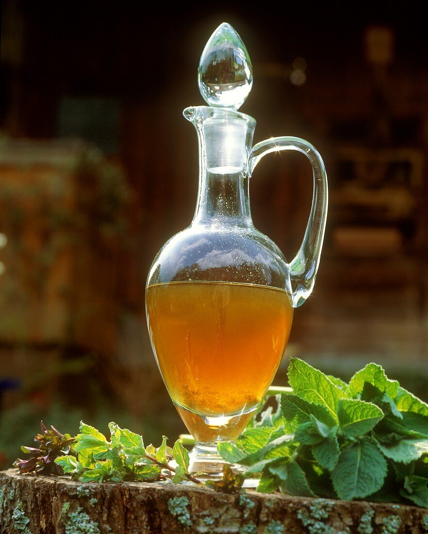 Mint syrup in a glass carafe