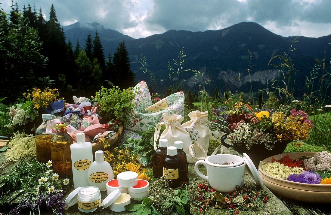 Still life with herbs & natural cosmetics in mountain pasture