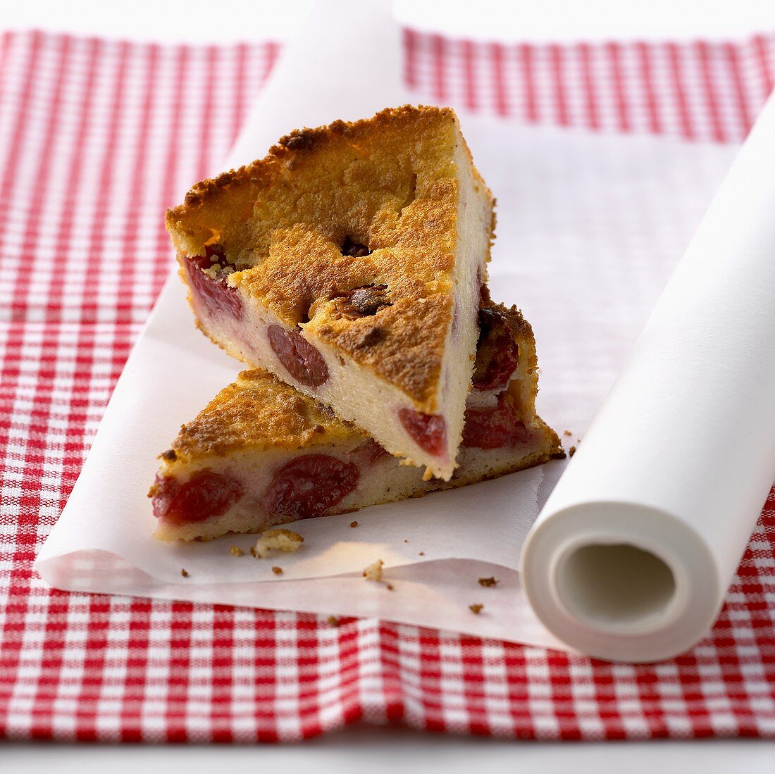 Two pieces of semolina cake with cherries