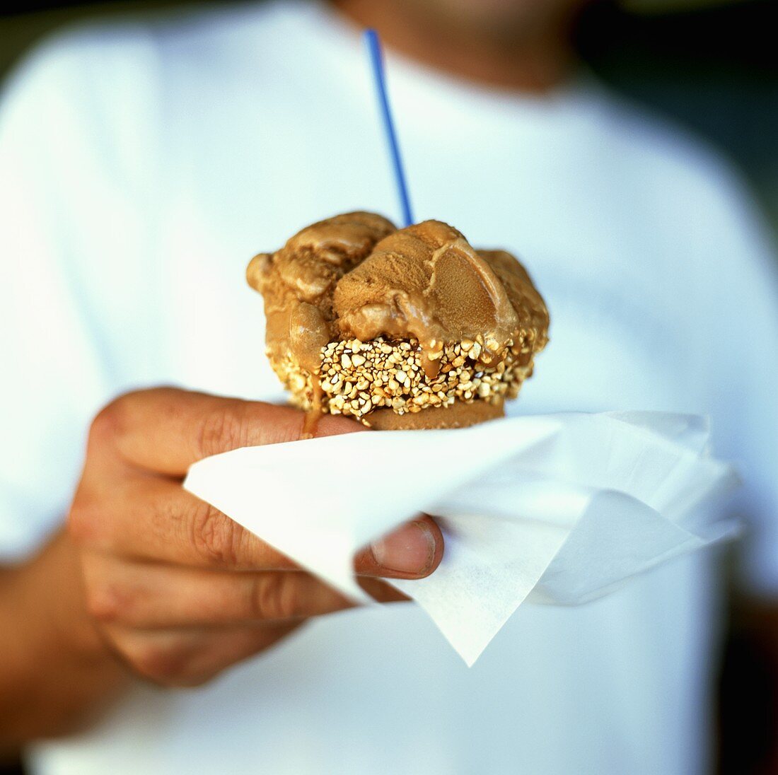 Caramel ice cream with slivered almonds in wafer