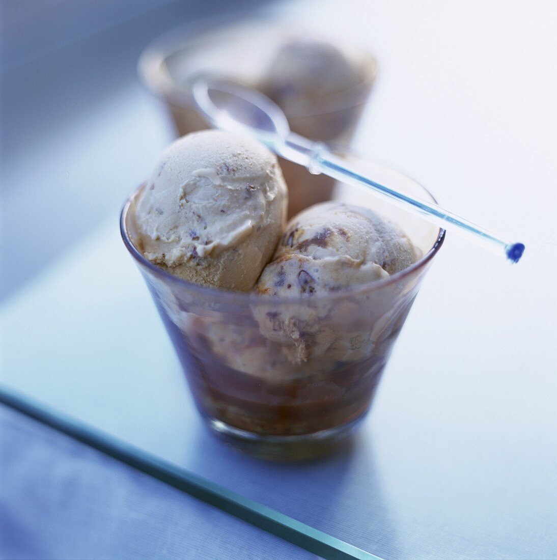 Walnut ice cream in small glass bowl