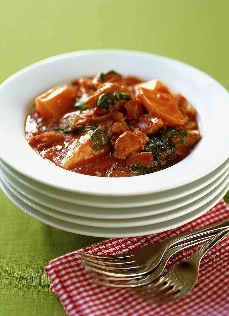 Pork goulash with potatoes and spinach