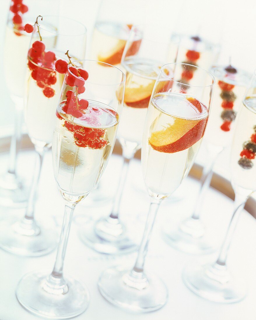 Champagne glasses with fruit