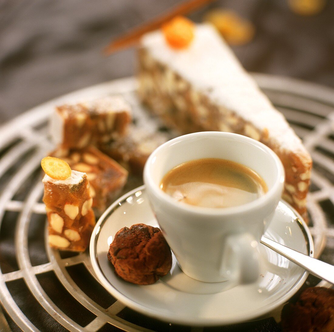 A cup of espresso with chocolate biscuit & spice cake