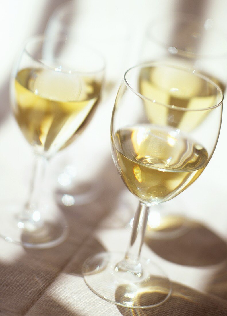 A Table Set with White Wine Glasses