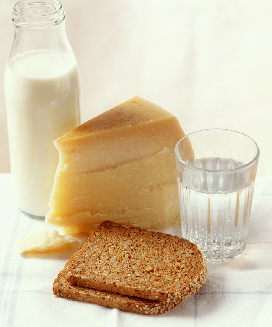 Slices of bread with Parmesan, water and milk