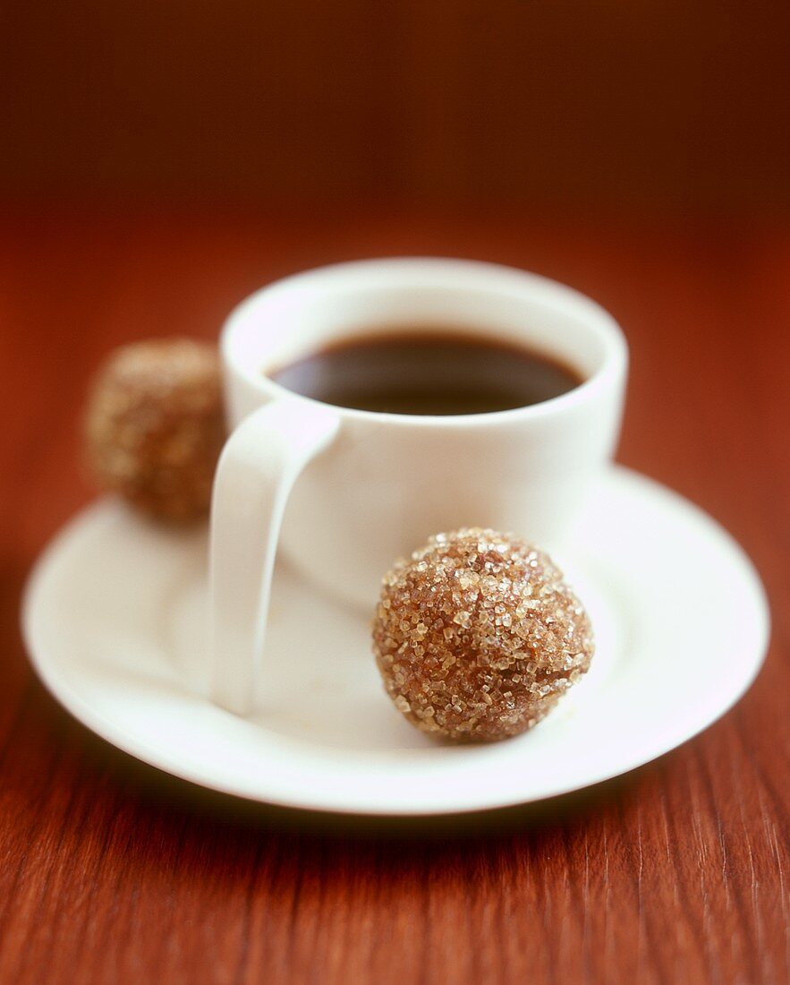 A cup of coffee with chocolate truffle