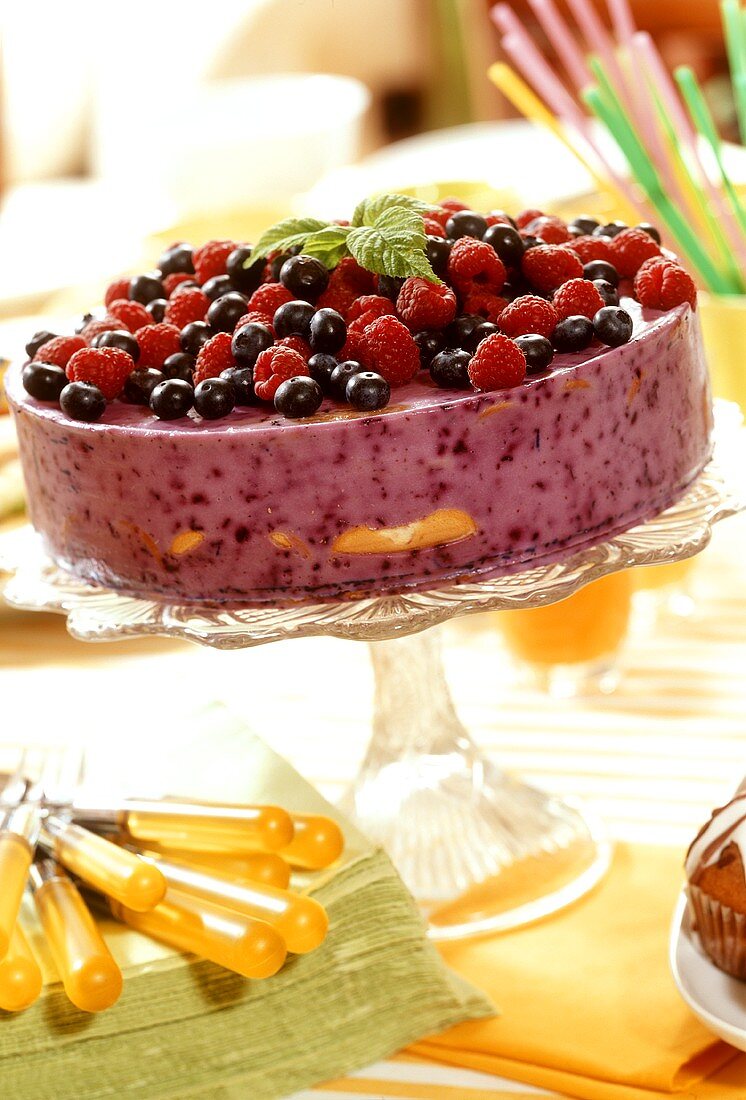 Quark cake with berries on cake stand