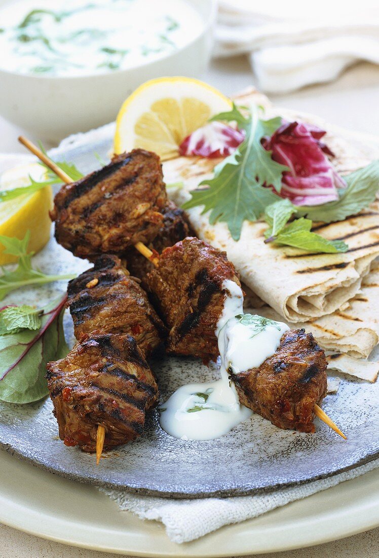 Moroccan style barbecued lamb kebabs with yoghurt sauce