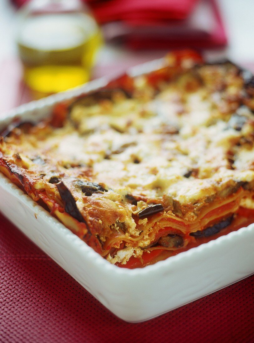 Vegetable lasagne in a white baking dish