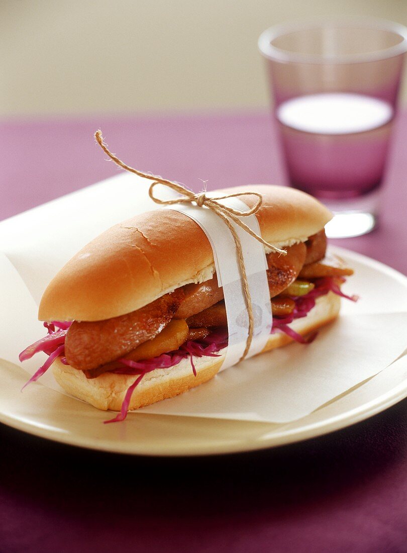 Sausage, apple and red cabbage sandwich