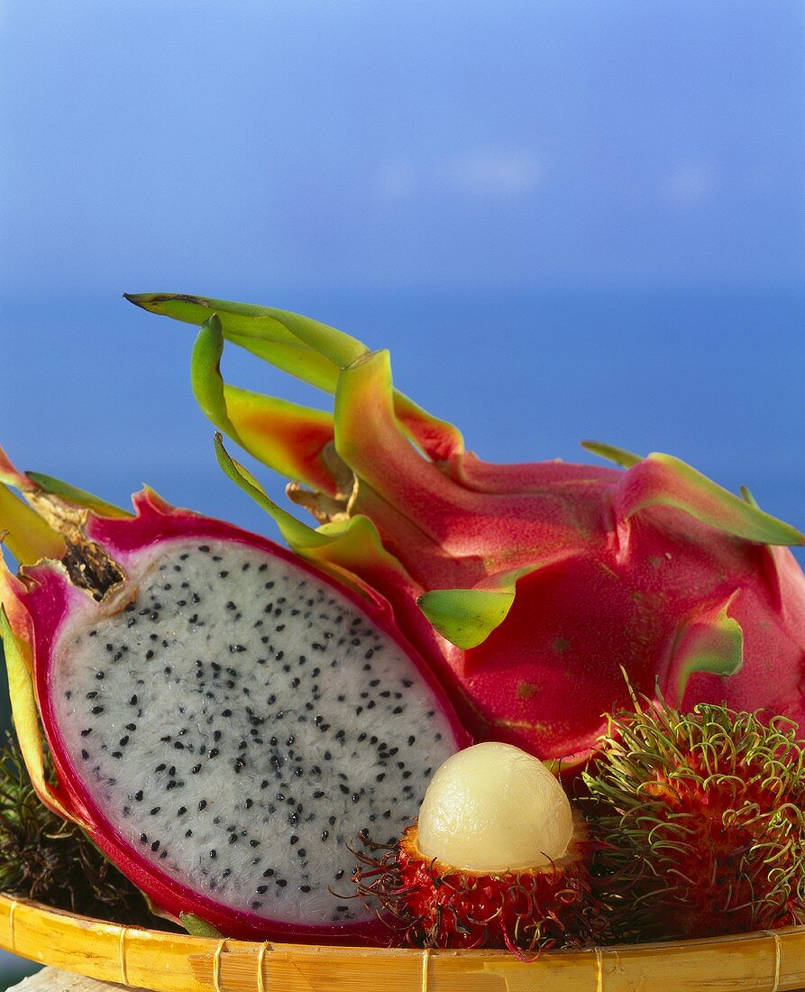 Red pitahaya, whole and halved, lychees