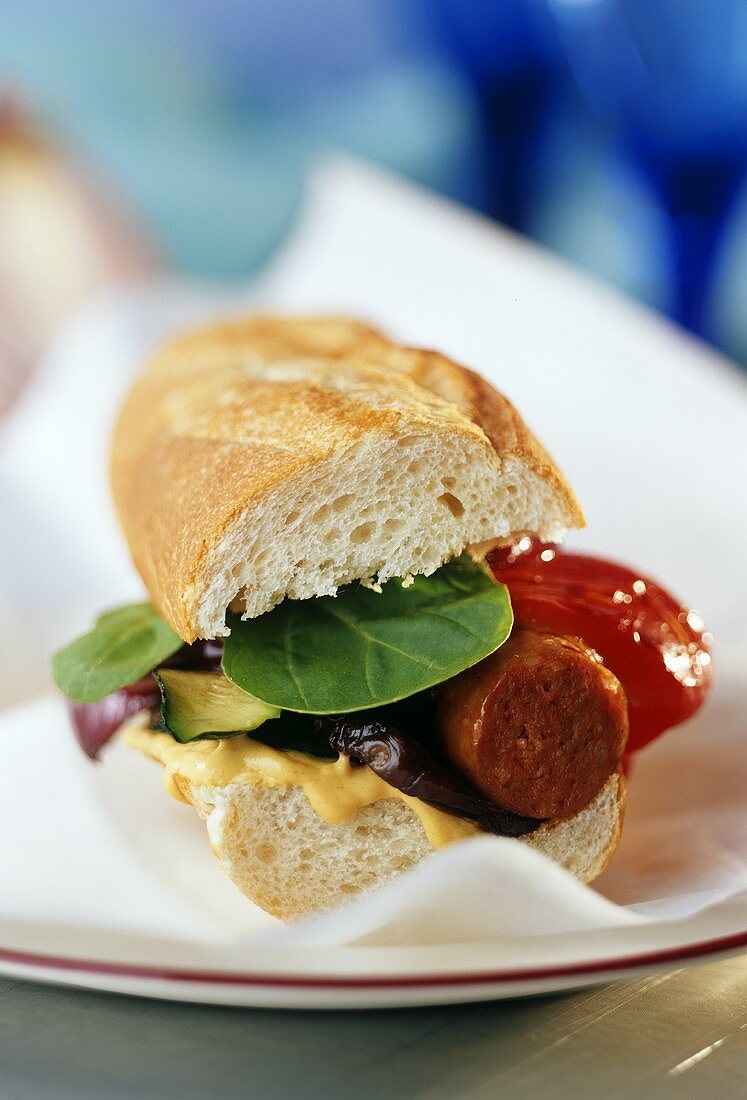 Paprika sausage and grilled vegetables in a sandwich