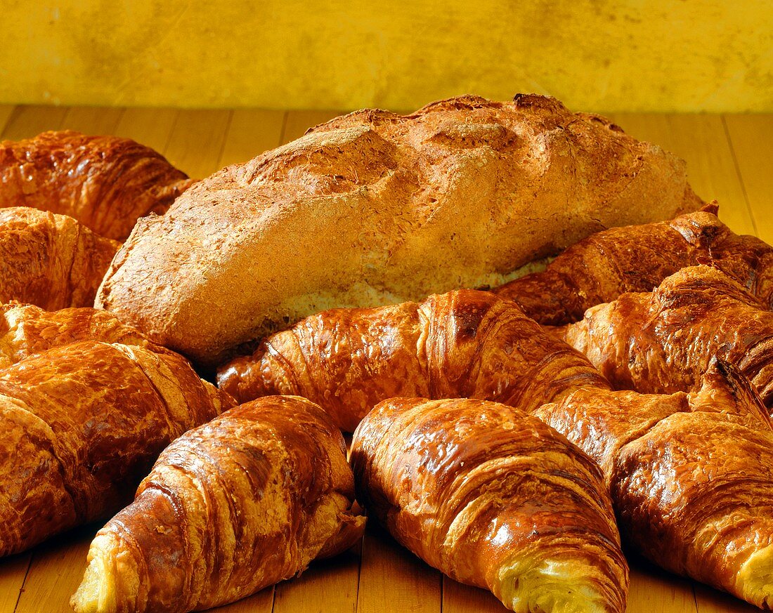 Fresh croissants and a loaf of bread