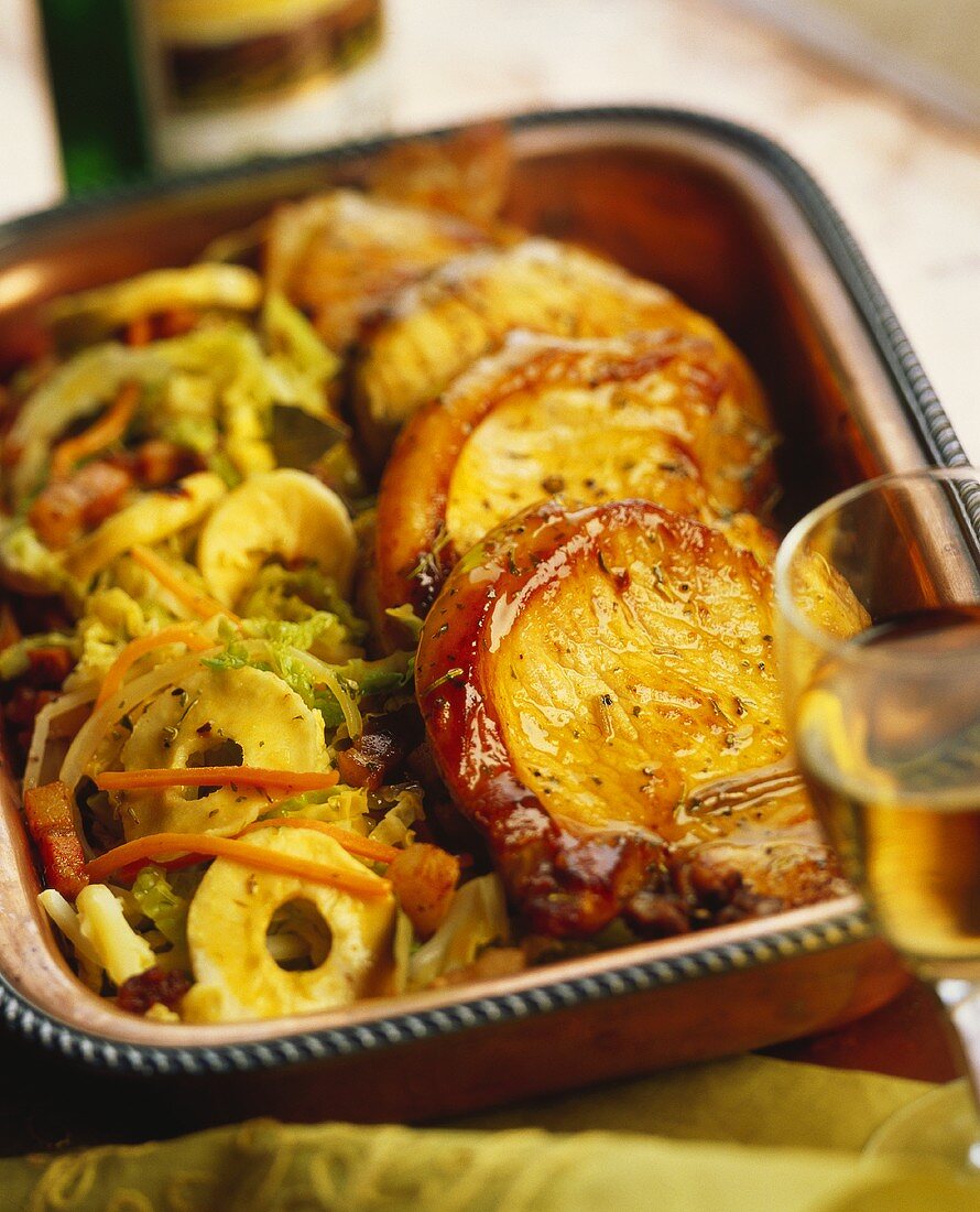 Pork chops with vegetables, cabbage and apples