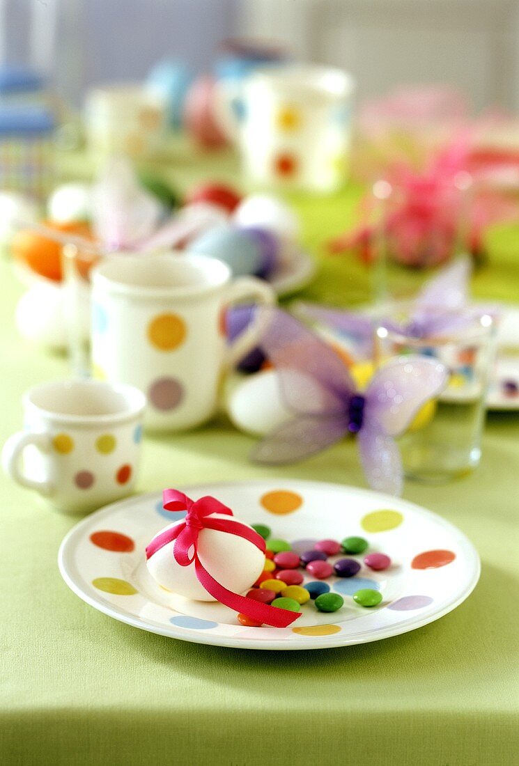 Colourful Easter table with chocolate beans