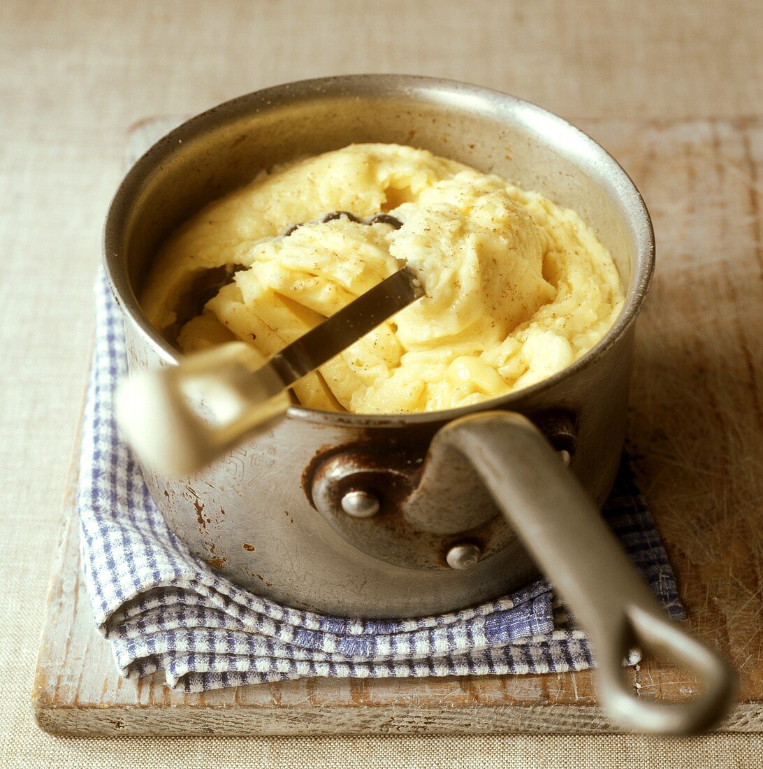 Fresh mashed potato in pan with handle