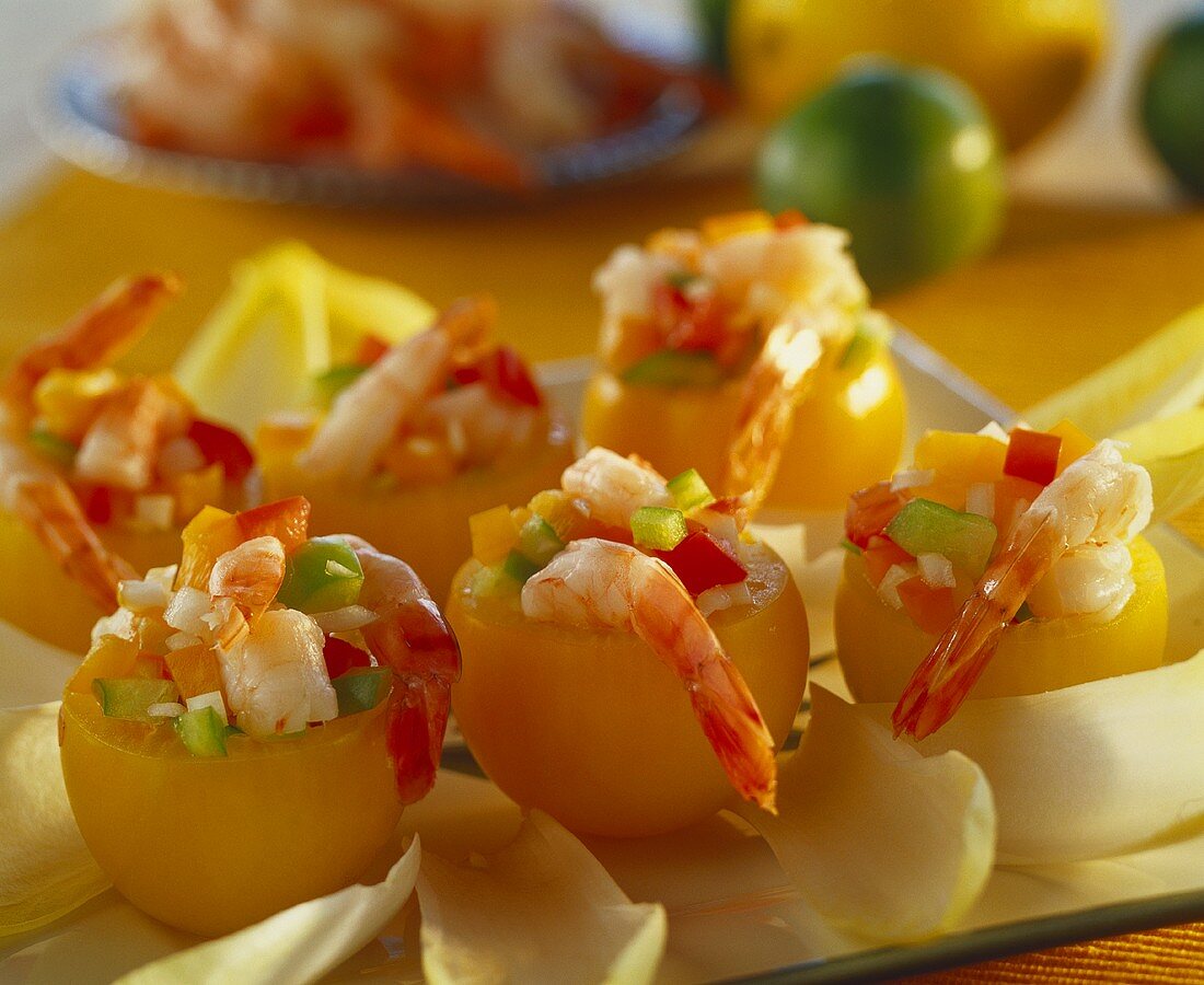 Yellow tomatoes stuffed with shrimps and peppers