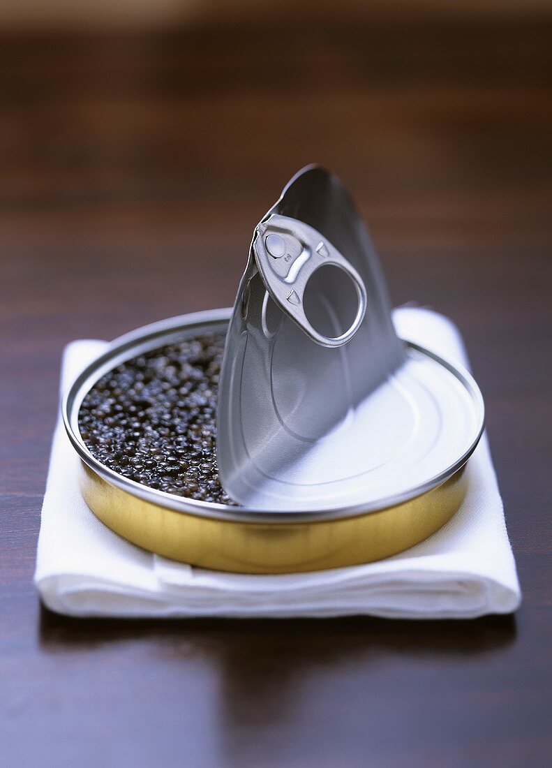 Russian sturgeon caviare in an opened tin on napkin