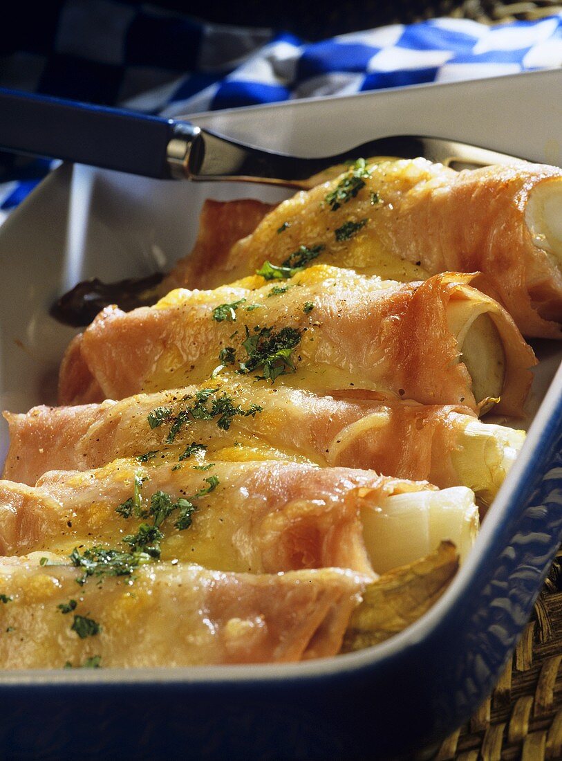 Chicory rolls with ham and cheese sauce