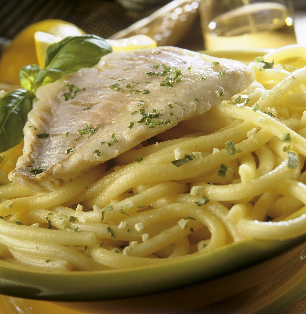 Fish fillet on macaroni with lemon sauce