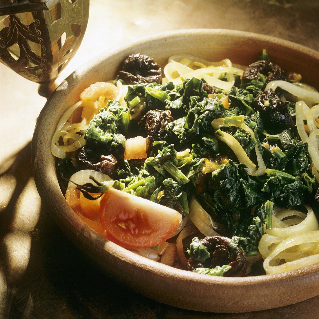 Middle Eastern spinach with prunes and tomatoes