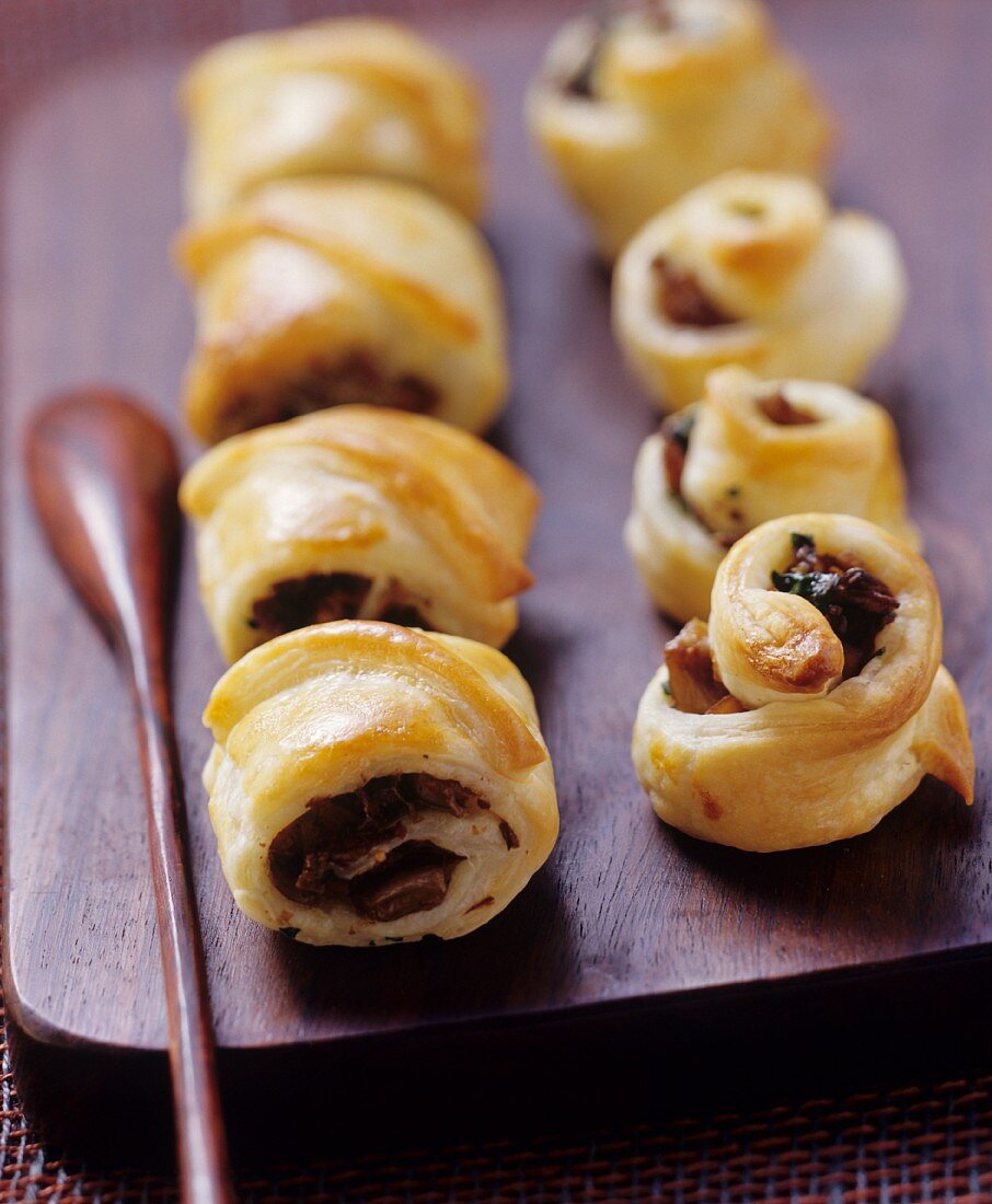 Puff pastry rolls with mushroom filling