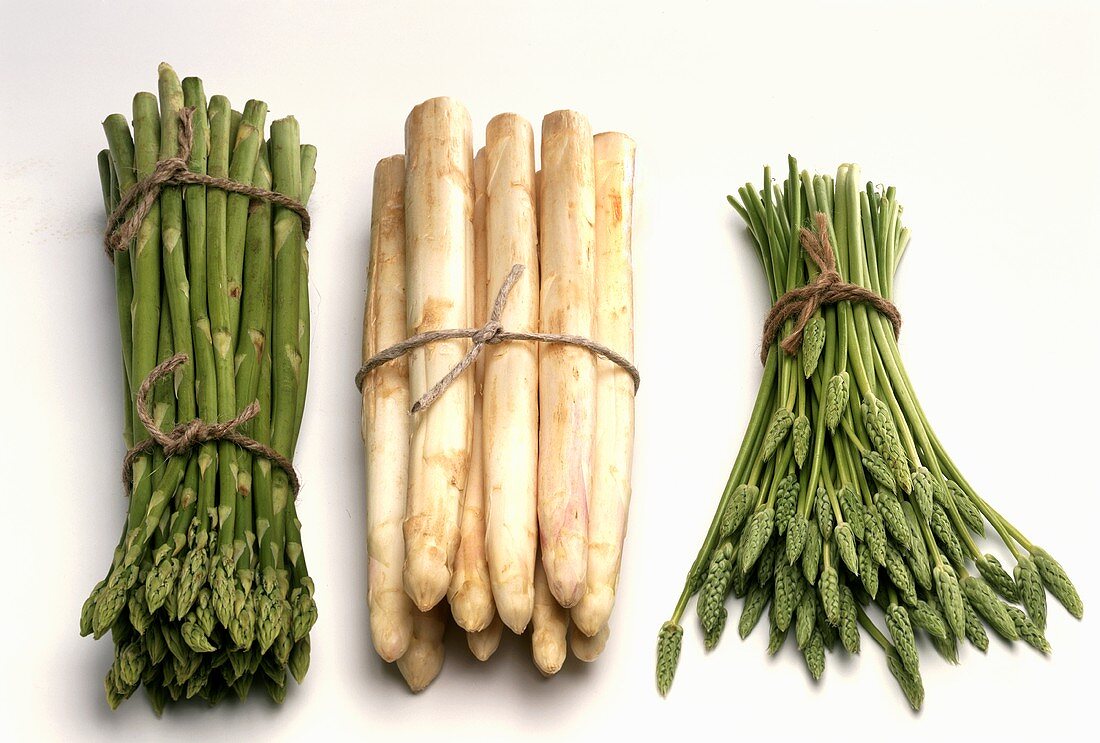 Three bunches of asparagus: green, white and wild asparagus