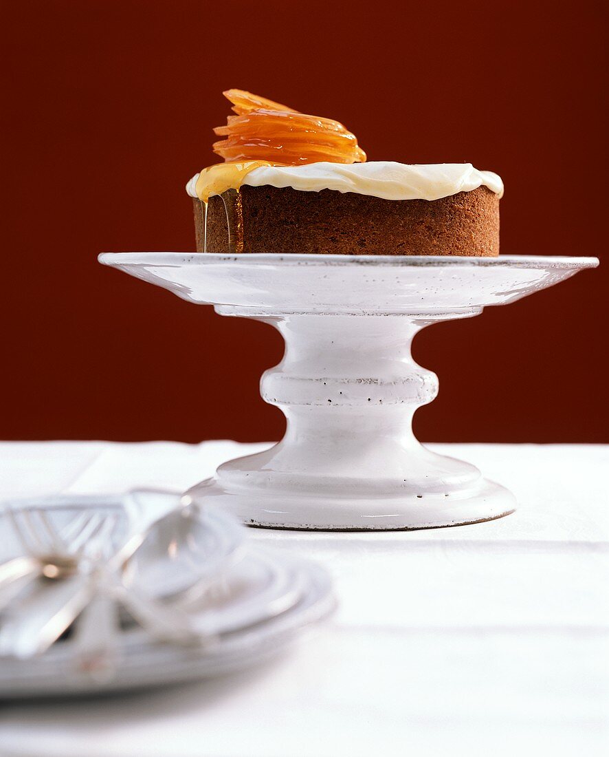 Orange cake on a cake stand