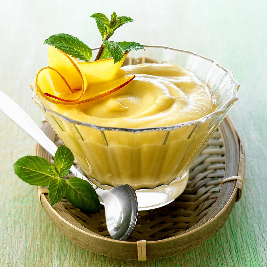 Asian mango cream in small glass bowl