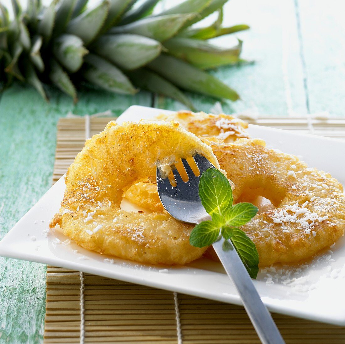 Baked pineapple slices with icing sugar (China)
