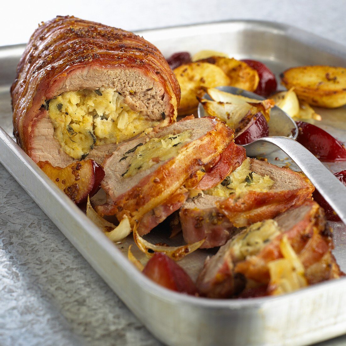 Stuffed pork fillet with baked plums