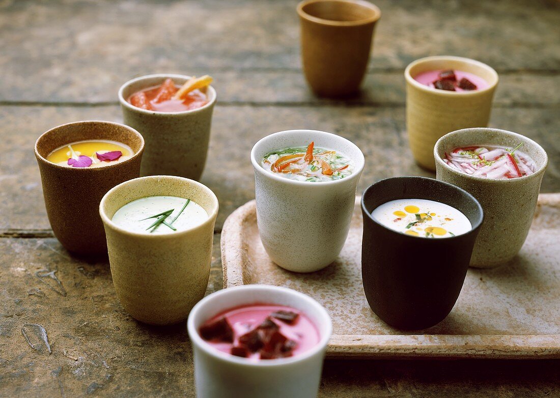 Various soups in beakers